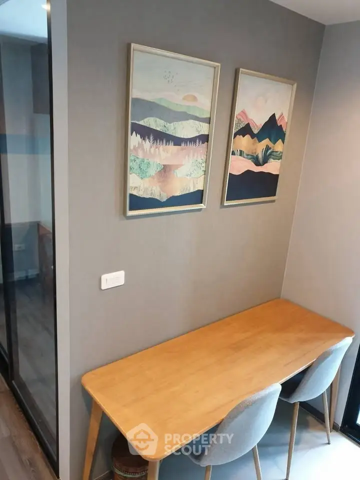 Cozy study nook with modern wooden desk and stylish artwork