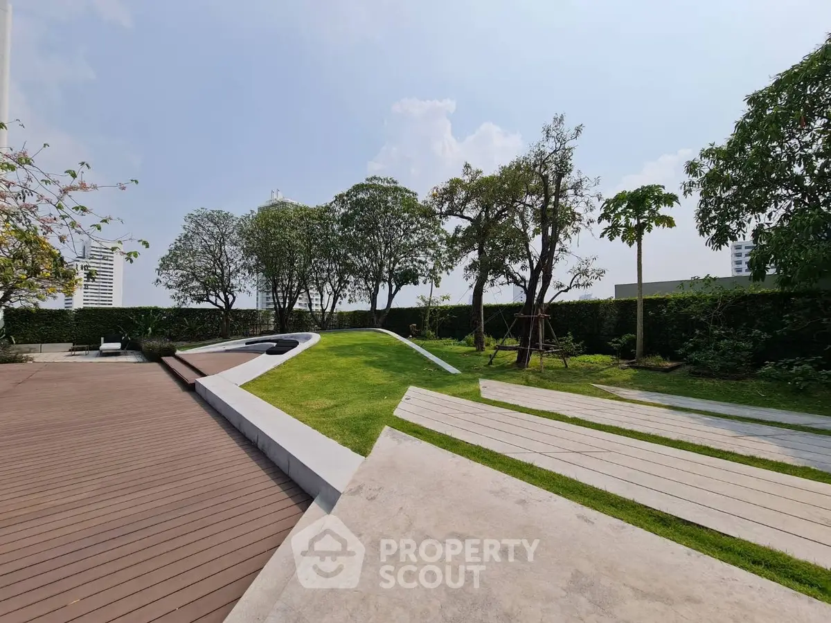 Luxurious garden area with modern landscaping and lush greenery in a high-end property.