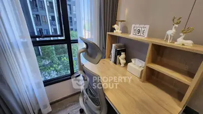 Modern study room with stylish desk and ergonomic chair, overlooking urban view through large window.
