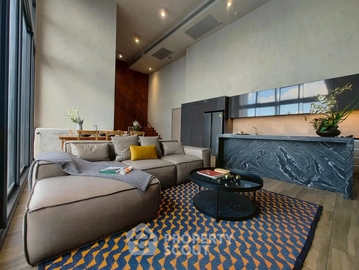 Luxurious modern living room with open kitchen and stylish decor