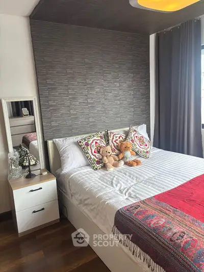 Cozy bedroom with stylish decor and plush bedding, perfect for relaxation.