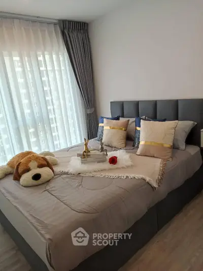 Cozy bedroom with plush bed and elegant decor in modern apartment