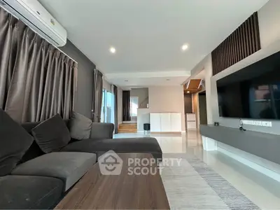 Spacious modern living room with sleek design and large sectional sofa
