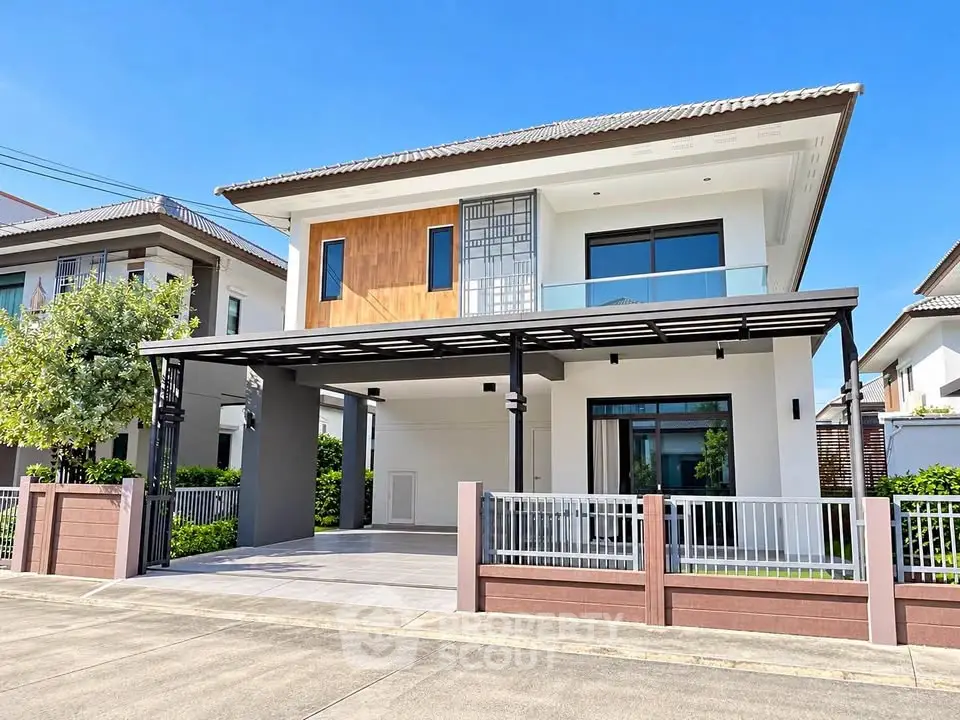 Modern two-story house with large windows and a spacious driveway in a suburban neighborhood.