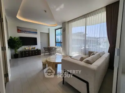 Luxurious modern living room with panoramic windows and elegant decor