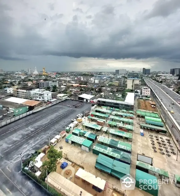 Stunning cityscape view from high-rise building with expansive skyline and vibrant urban landscape.