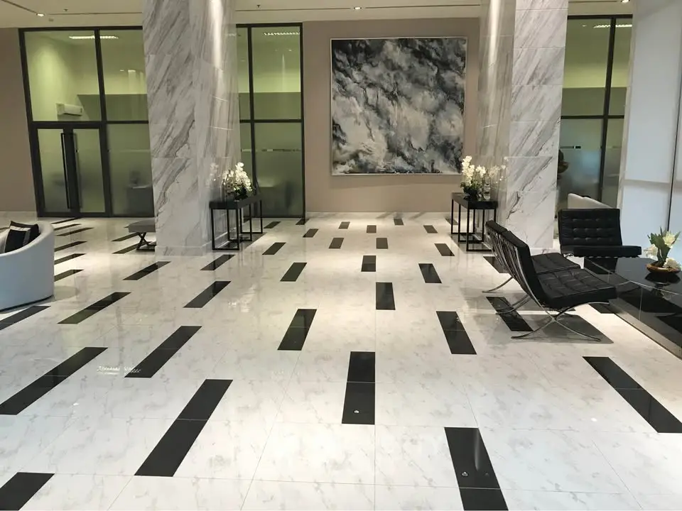 Luxurious marble-floored lobby with modern seating and elegant decor