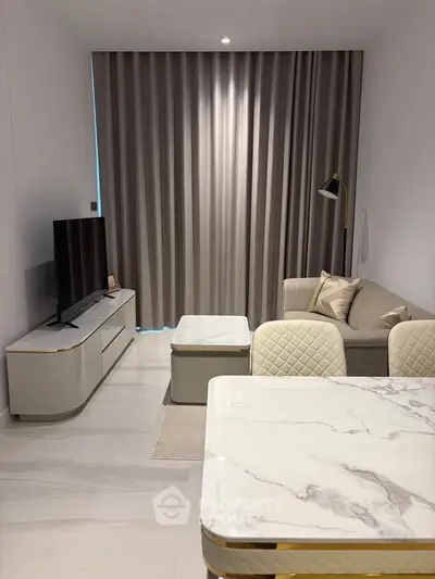 Modern living room with elegant marble table and cozy sofa in a stylish apartment.