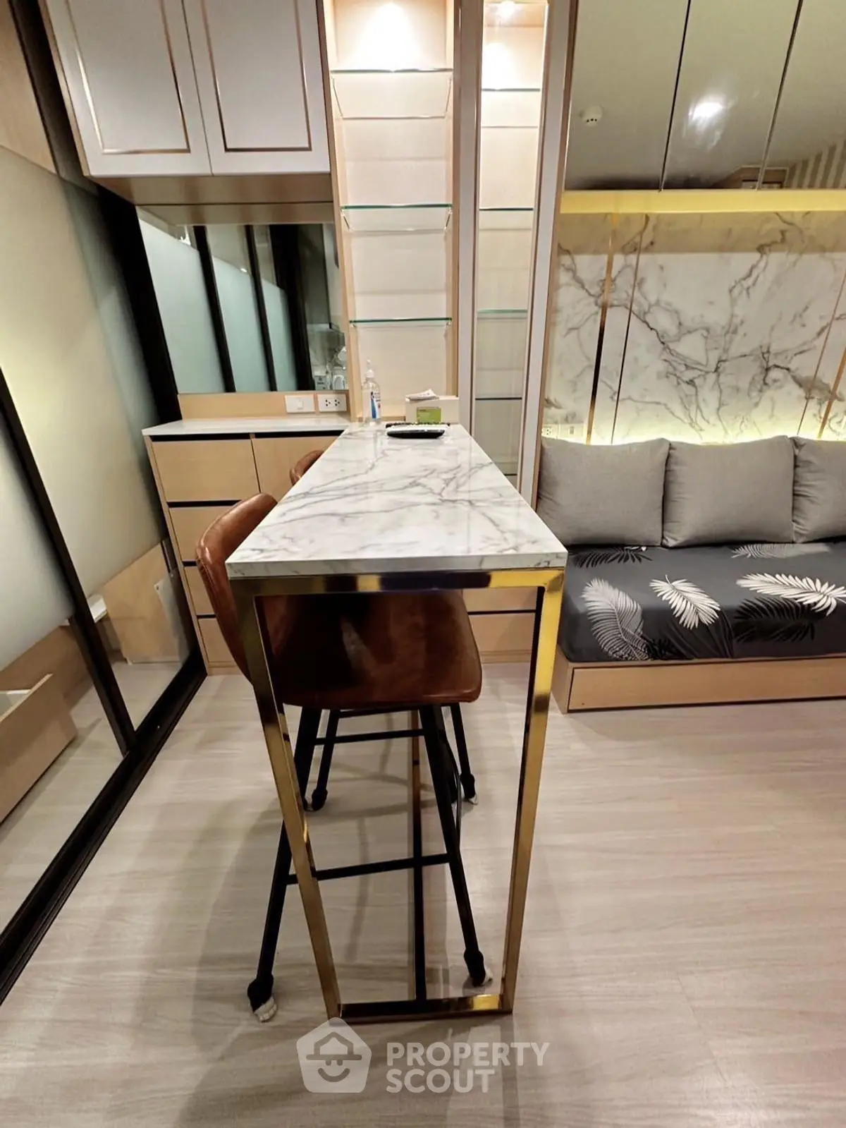 Modern interior with sleek marble table and stylish seating in a cozy living space.
