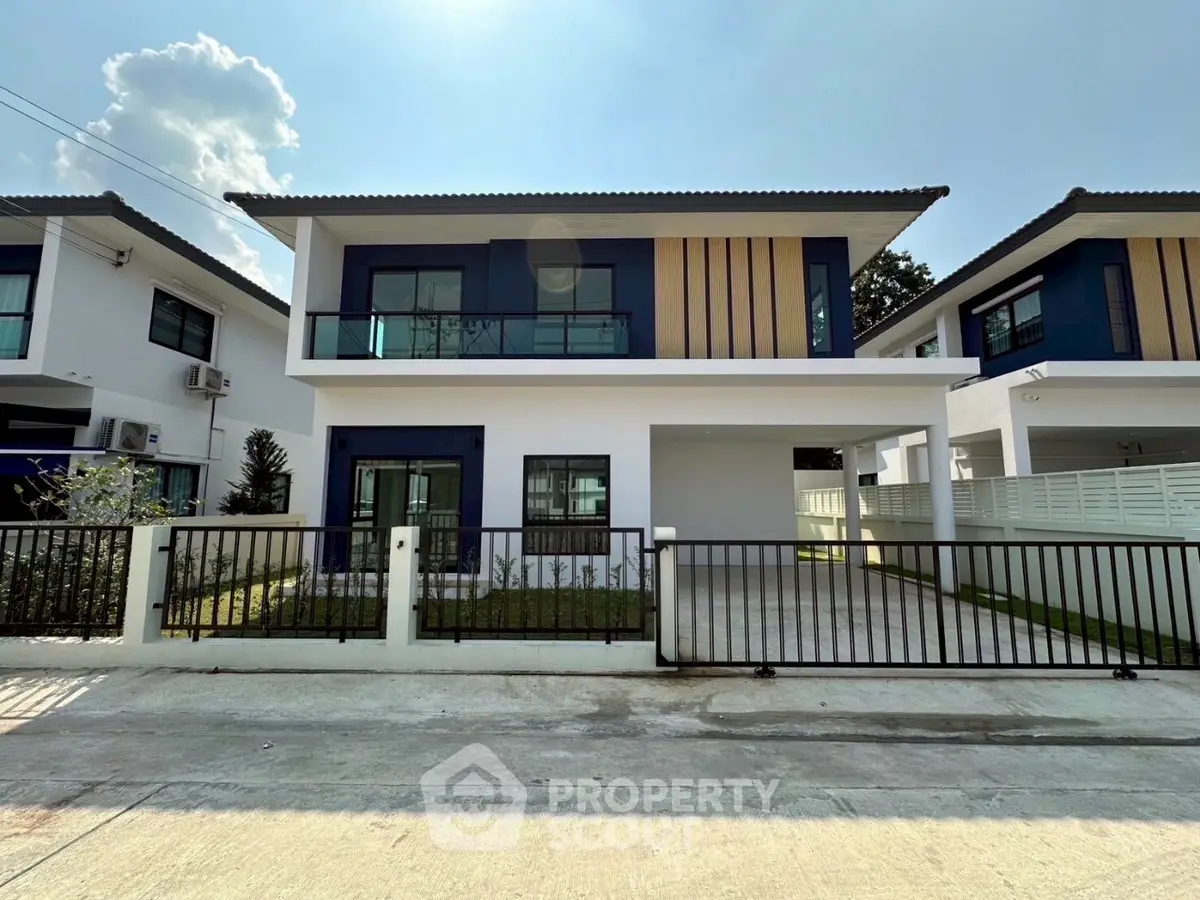 Modern two-story house with spacious driveway and sleek design