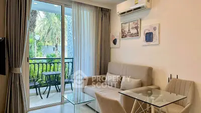 Chic living room with balcony view, modern decor, and cozy seating area.