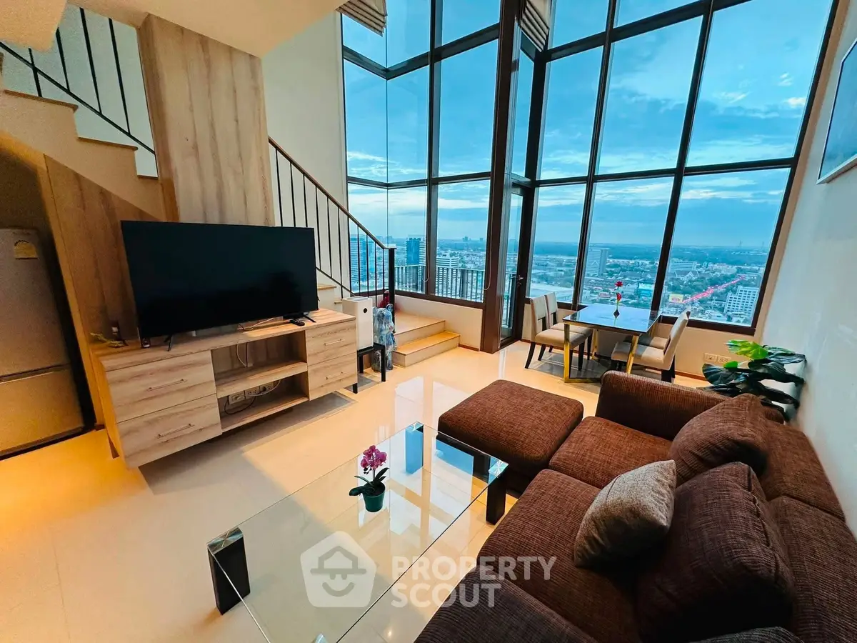 Luxurious living room with floor-to-ceiling windows and stunning city view