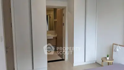 Modern bedroom with ensuite bathroom and minimalist decor