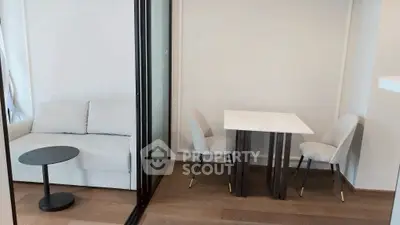 Modern living area with sleek furniture and wooden flooring
