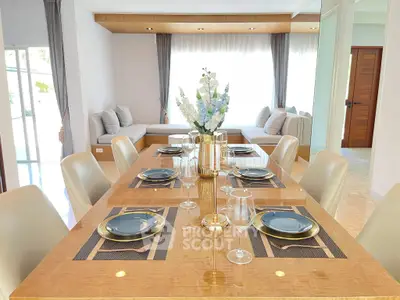 Elegant dining room with stylish table setting and cozy seating area, perfect for entertaining guests.