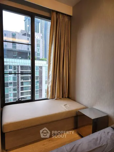 Cozy bedroom with city view and modern furnishings