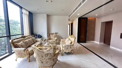 Luxurious living room with elegant furniture and large windows offering scenic views.