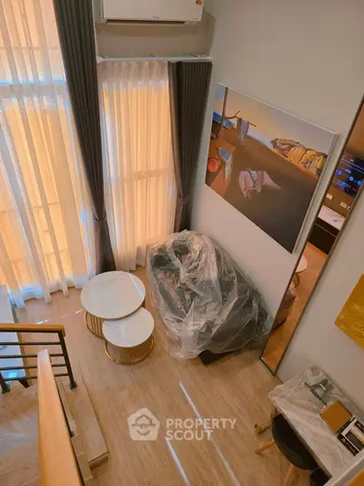 Modern duplex interior with stylish decor and large windows