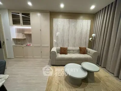 Modern living room with stylish sofa and nested coffee tables