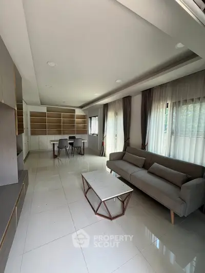 Spacious modern living room with elegant furniture and natural light