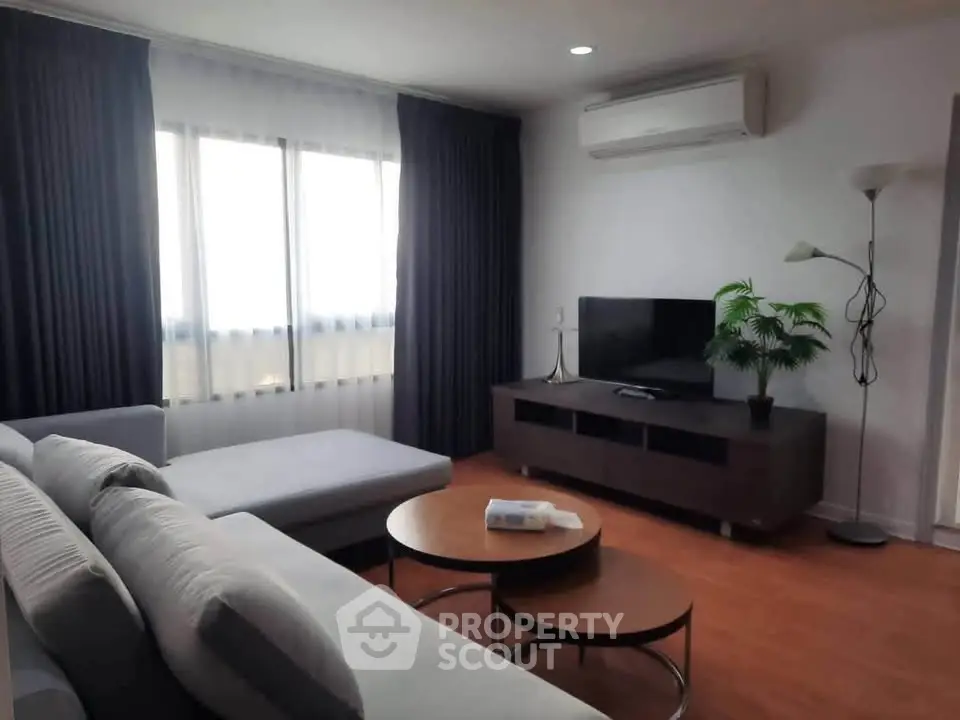 Spacious living room with modern furniture and natural light