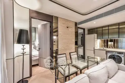 Luxurious modern apartment interior with open kitchen and dining area, featuring sleek appliances and elegant decor.