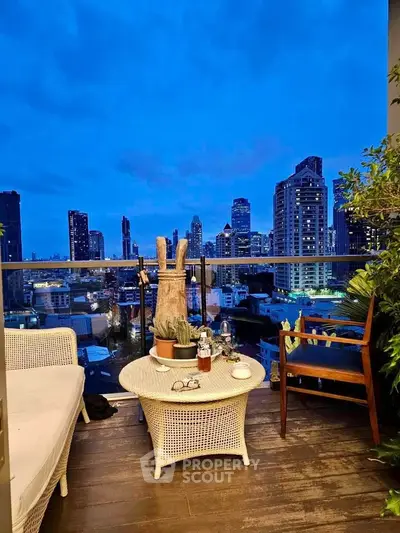 Charming balcony with stunning city skyline view at dusk, perfect for relaxation and entertaining.