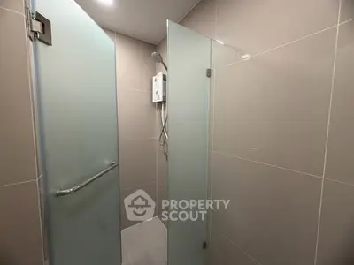 Modern bathroom with glass shower doors and sleek design
