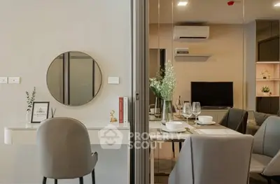 Modern living room with elegant dining setup and stylish decor