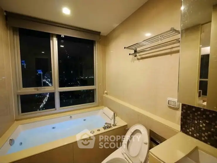 Luxurious bathroom with city view and modern bathtub