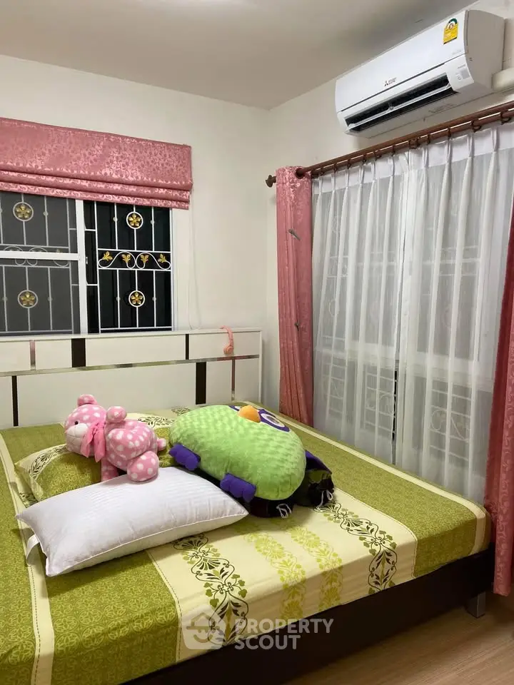 Cozy bedroom with air conditioning and decorative window curtains