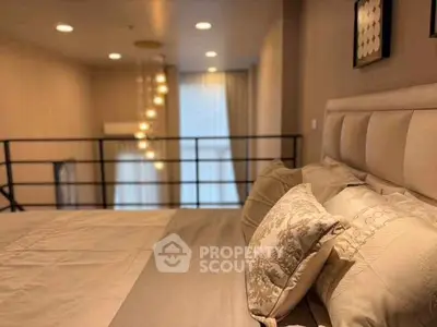 Luxurious bedroom with elegant decor and soft lighting in a modern apartment.