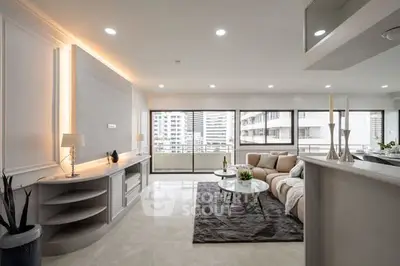 Luxurious modern living room with elegant decor and spacious layout, featuring large windows and stylish furniture.