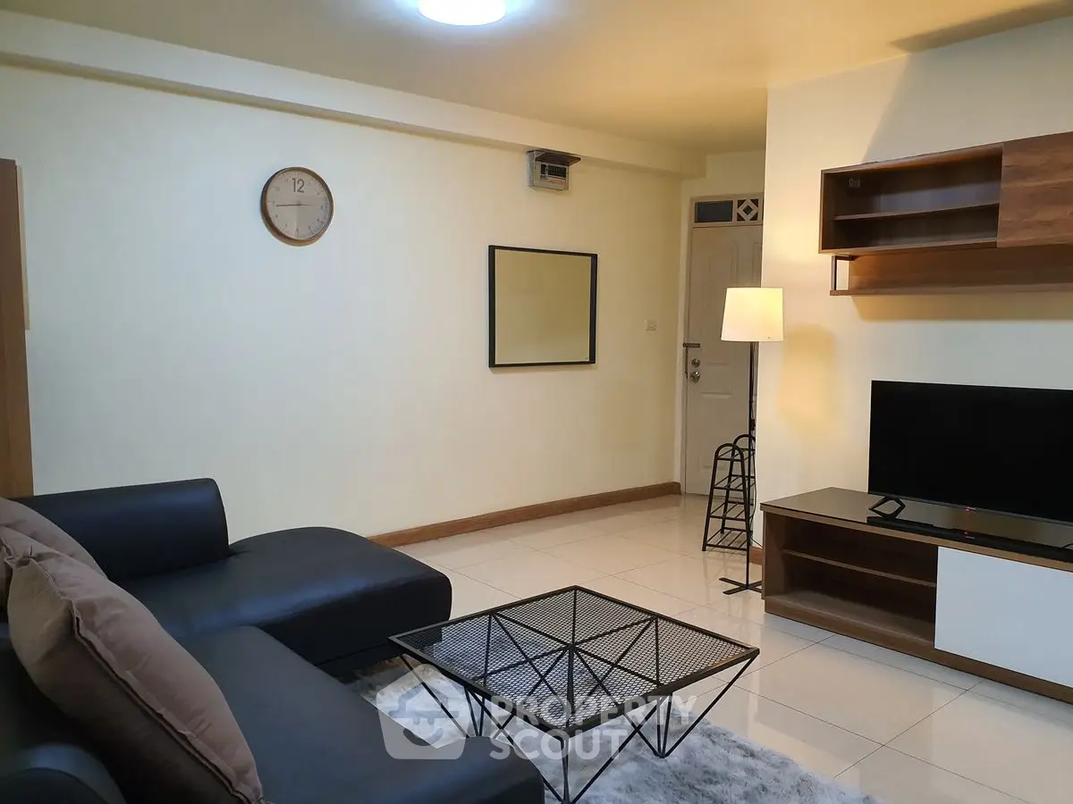 Modern living room with sleek furniture and stylish decor, perfect for relaxation and entertainment.