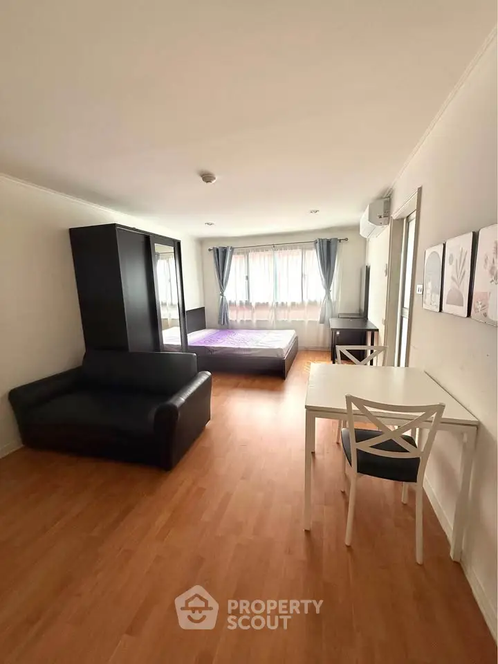 Spacious studio apartment with modern furnishings and natural light