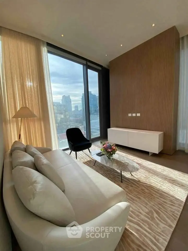 Luxurious living room with stunning city view, modern furniture, and elegant decor.