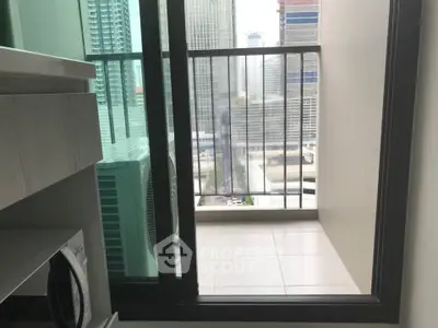 Modern apartment balcony with city view and sliding glass door