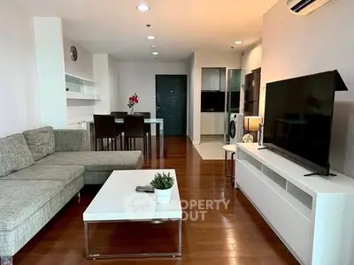 Spacious modern living room with sleek furniture and open layout