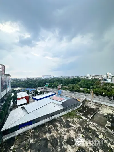 Stunning aerial view of urban landscape with lush greenery and expansive skyline.