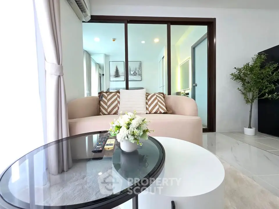 Modern living room with stylish decor and glass sliding doors