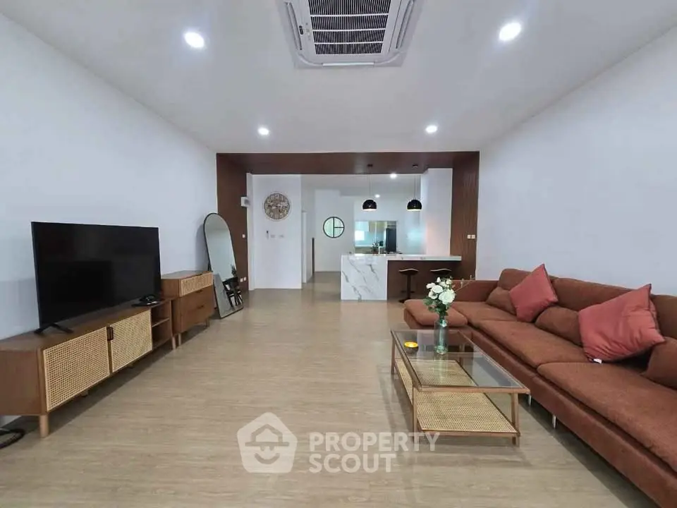 Spacious modern living room with stylish furniture and open layout