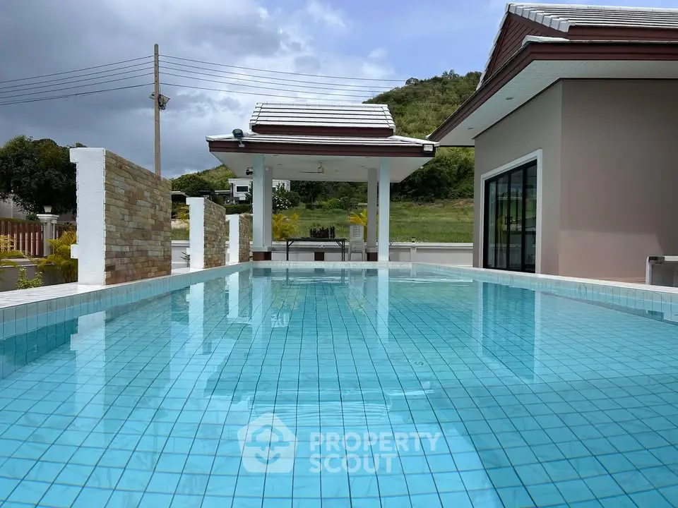 Luxurious modern villa with private pool and scenic mountain views, perfect for relaxation and entertainment.