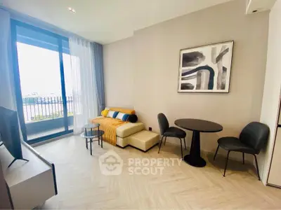 Modern living room with stylish decor and balcony view