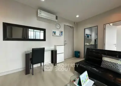 Modern living room with sleek furniture and air conditioning in a stylish apartment.