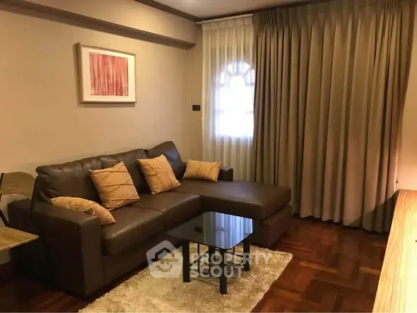 Cozy living room with brown leather sofa and elegant decor