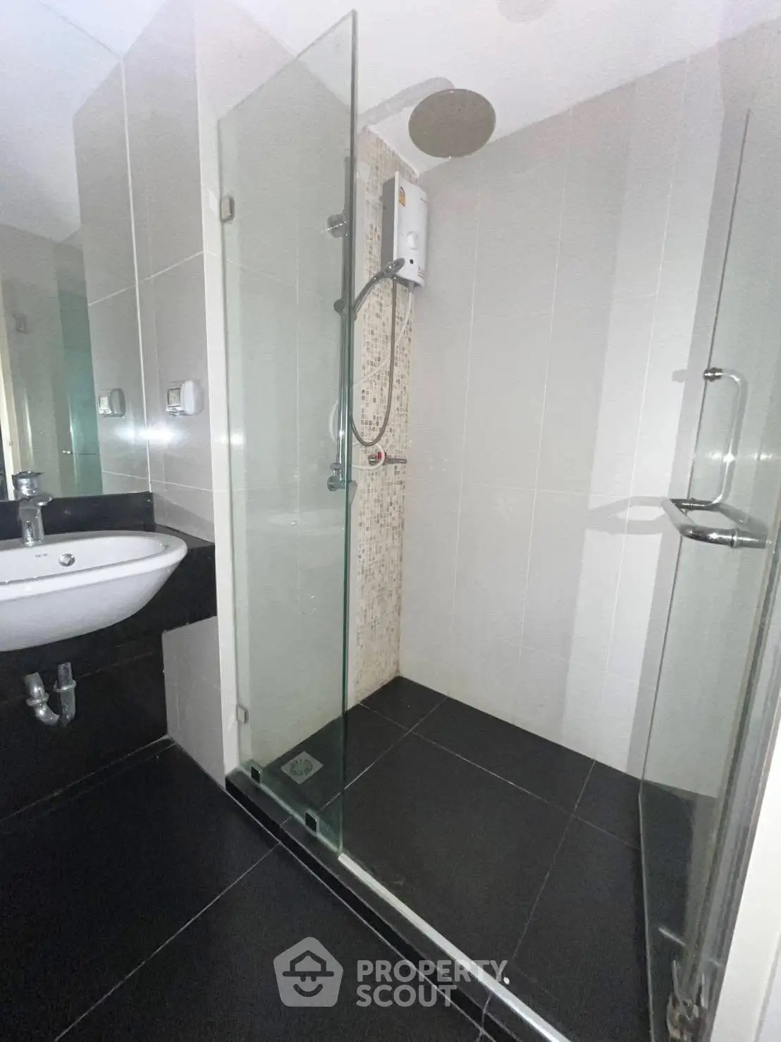 Modern bathroom with sleek glass shower and contemporary fixtures