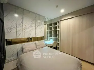 Modern bedroom with stylish built-in storage and elegant marble accents