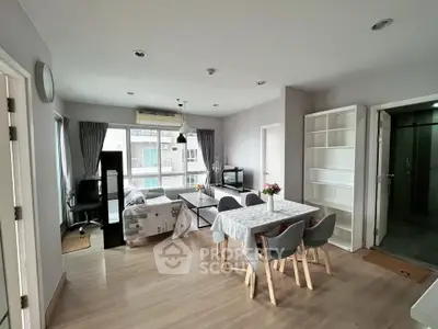 Spacious modern living room with dining area and large windows