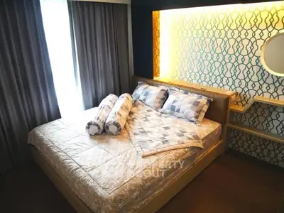 Stylish bedroom with modern decor and ambient lighting