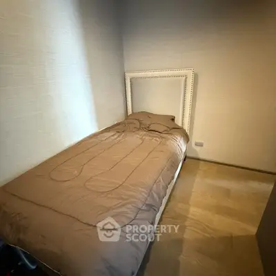 Cozy minimalist bedroom with single bed and neutral decor